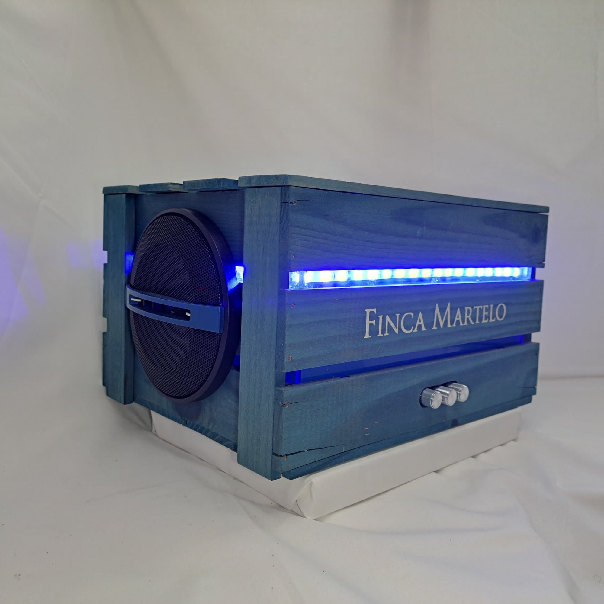 Blue painted wine crate speaker with a strip of blue light