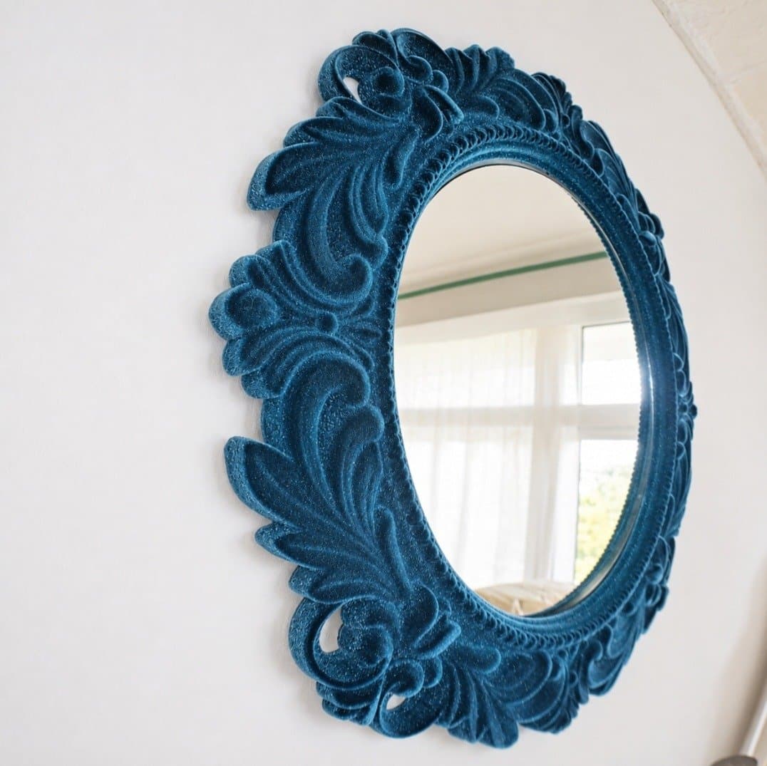 Ornate oval mirror frame flock coated in deep teal