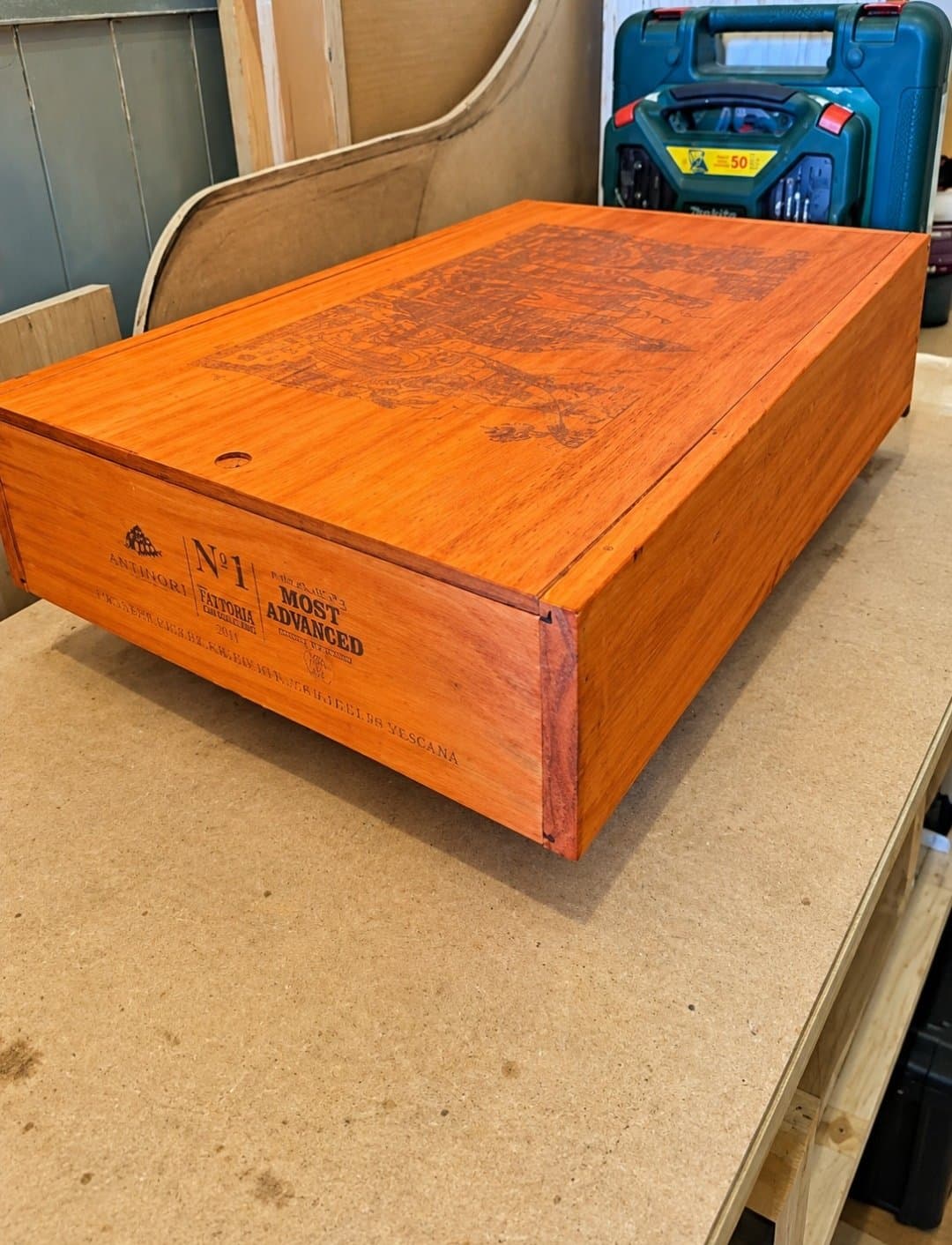 Orange stained wine box on a workbench